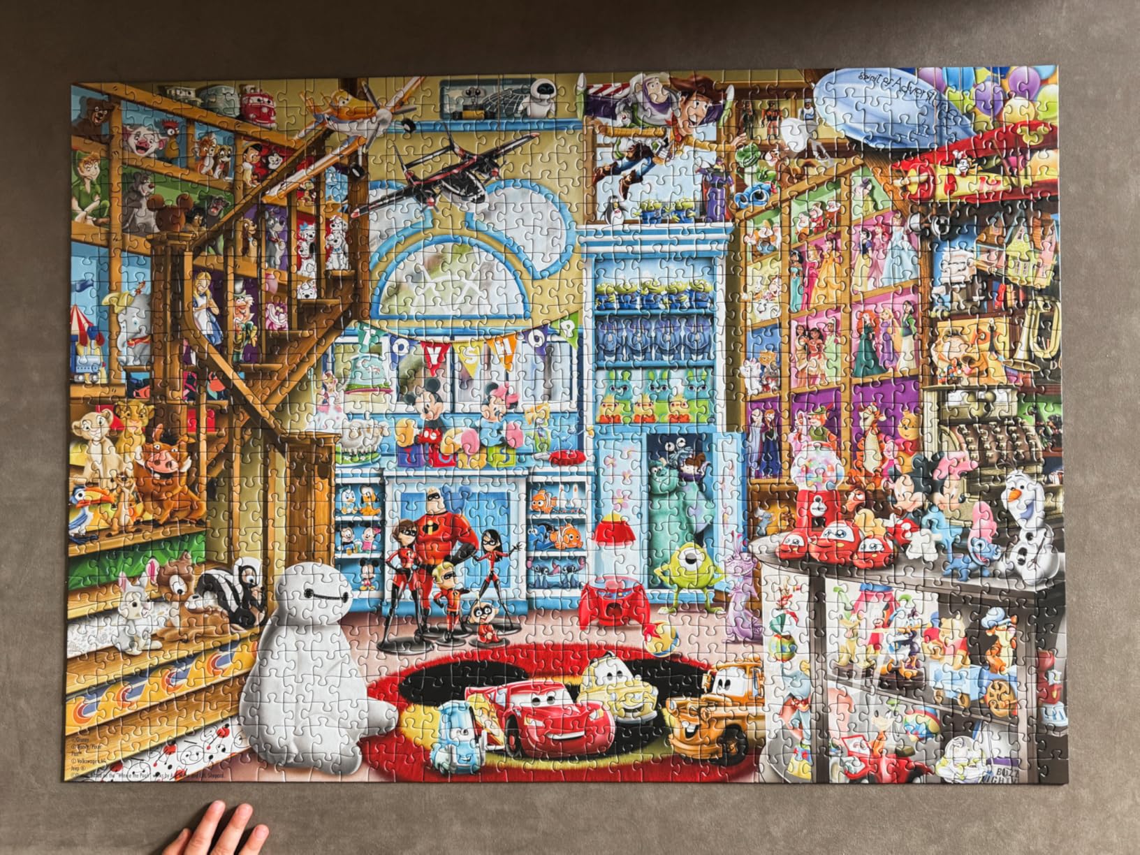 Ravensburger Disney & Pixar - 1000 Piece Jigsaw Puzzle - Stunning, Vivid Imagery of Favorites Mickey Mouse, Olaf & More - Toy Shop Scene - Ideal Gift - Frameable Art - Puzzles for Adults customer photo 2