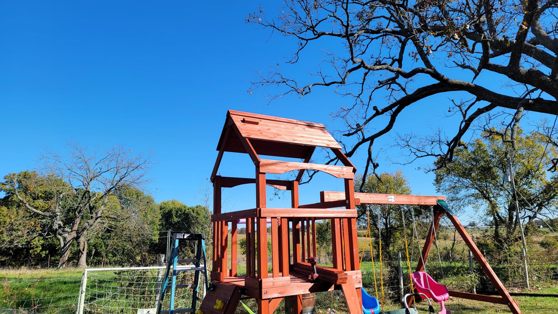 Gorilla Playsets Nantucket II Wood Swing Set with Wood Roof, Two Swings, Slide, Sandbox Area, Rock Wall, Redwood Color customer photo 1