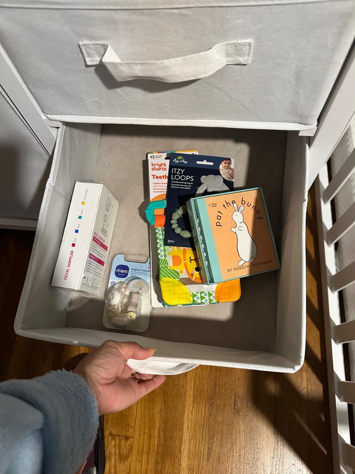 Badger Basket Baby Changing Table with Laundry Hamper & Storage - White | Modern nursery changing table with pad, safety belt, hamper, 3 storage baskets, safety rails & durable wood/MDF construction customer photo 1