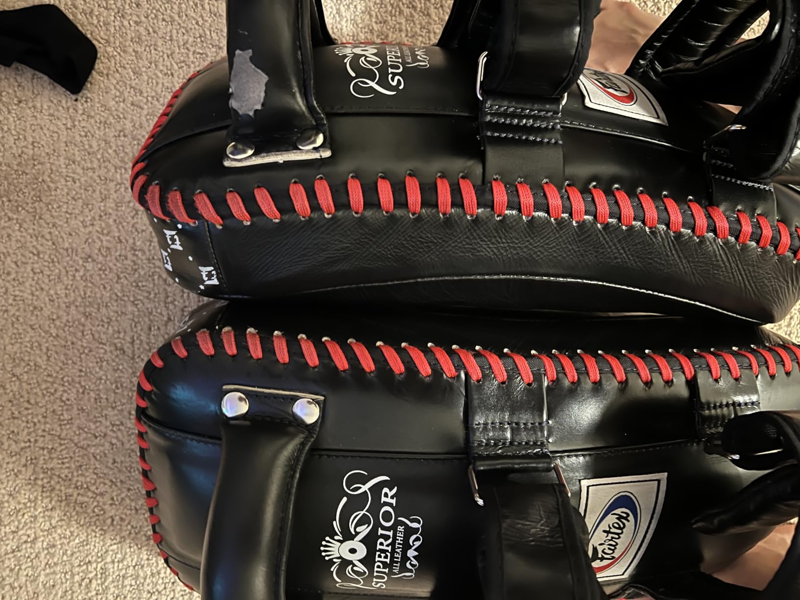 Fairtex KPLS2 Muay Thai Kick Pads, Genuine Leather Curved Boxing Shield | Premium cowhide construction with forearm support. Ergonomic grip with padded wrist straps protects trainers holding jabs customer photo 1