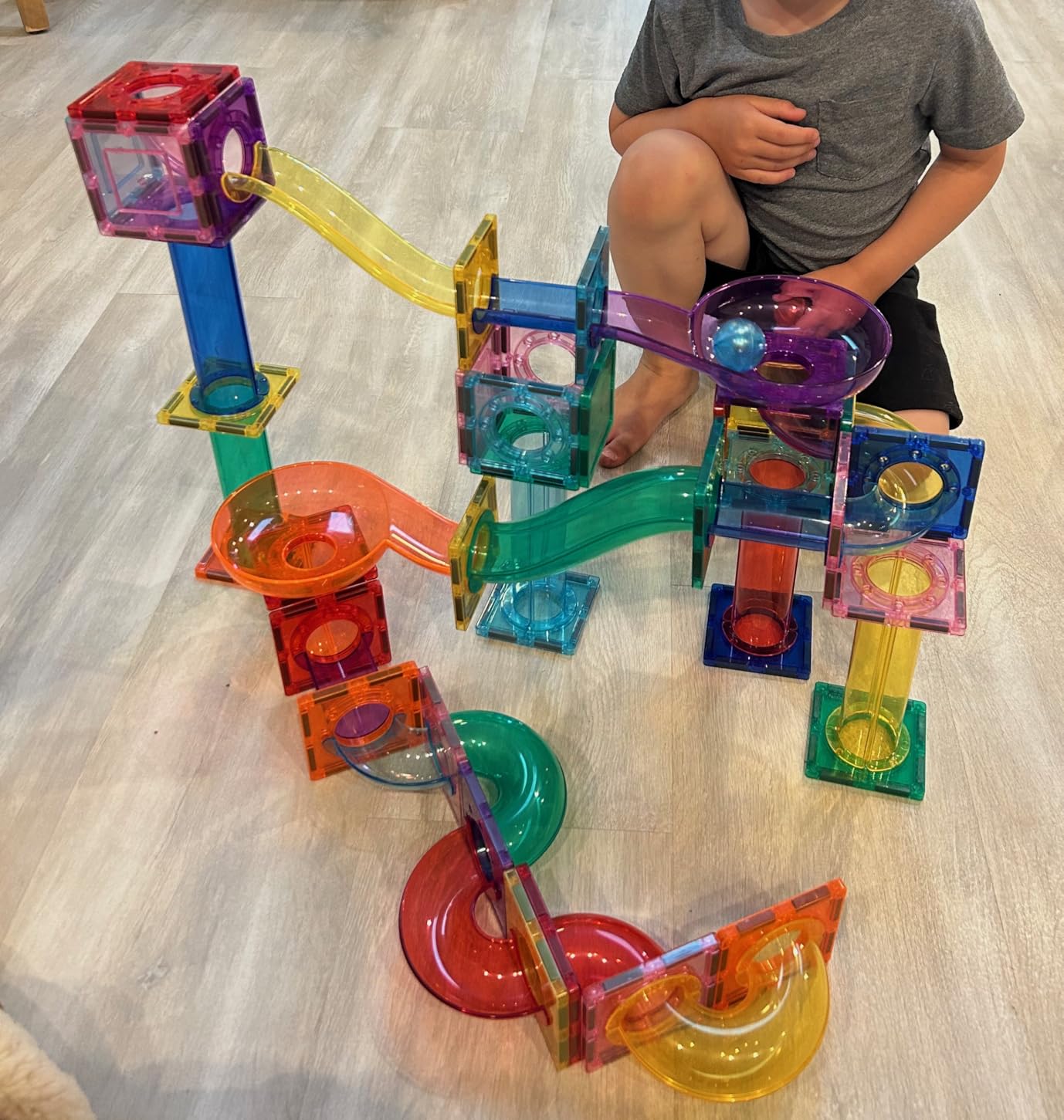 PicassoTiles 100 Piece Marble Run Magnetic Tiles Race Track STEM Ages 3+ | BPA-free ABS plastic, reinforced edges, curved slopes and U-turns, steel balls included, open-ended maze layouts, shared play customer photo 1
