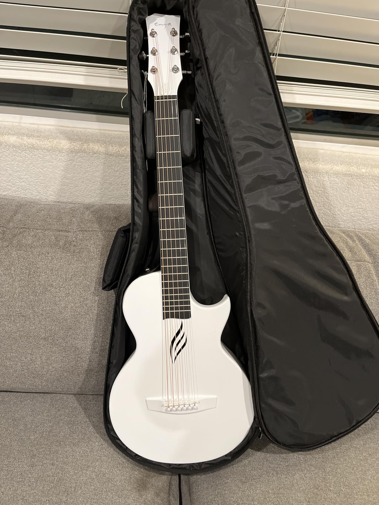 Enya NOVA GO Carbon Fiber 35-Inch Acoustic Travel Guitar, Black | Lightweight 3.7 lbs Design, Moisture-Resistant Body, Easy to Carry for Adults and Beginners, Gig Bag and Accessories Included customer photo 1