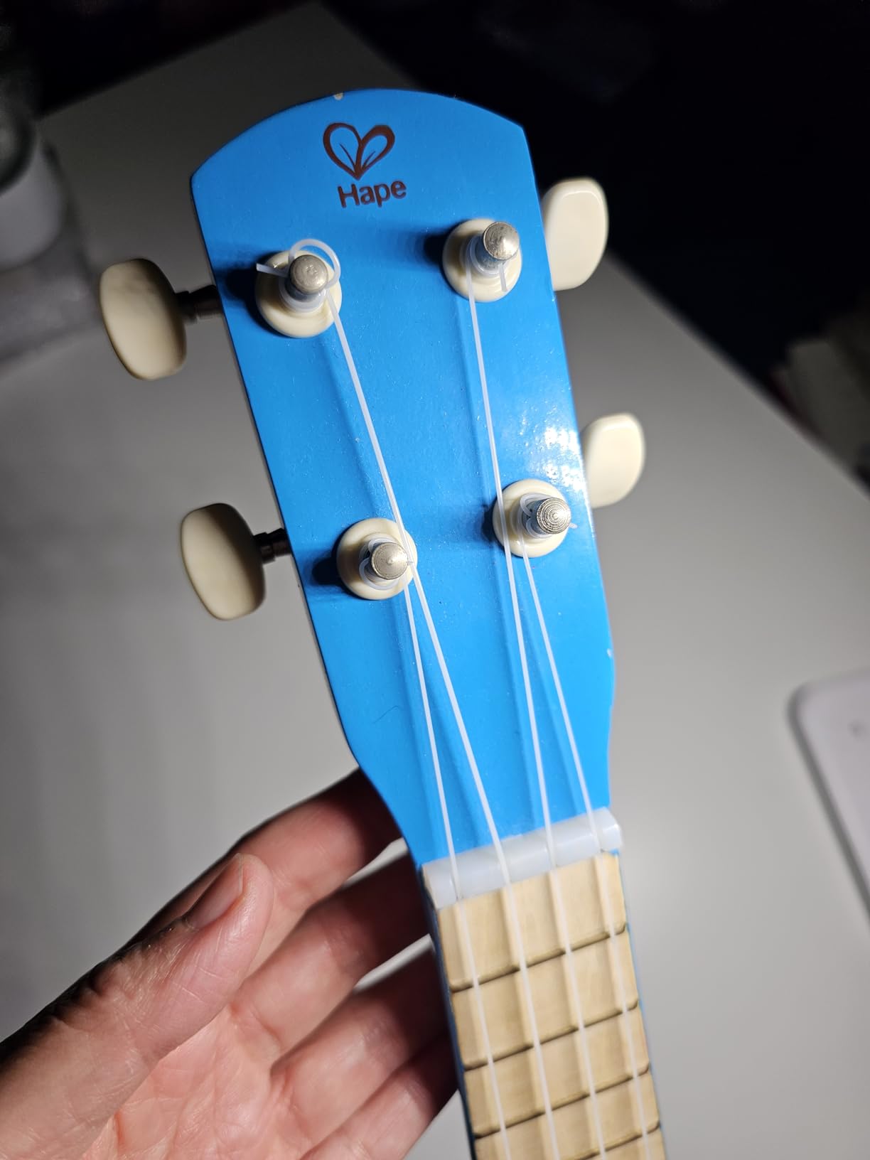 Hape Kid's Wooden Toy Ukulele, Red customer photo 2