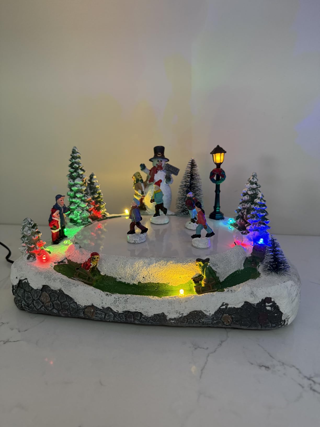 Animated Christmas Village Skating Pond - Lighted Musical Snow Scene with 4 Moving Skaters, Adapter, Battery Slot customer photo 1