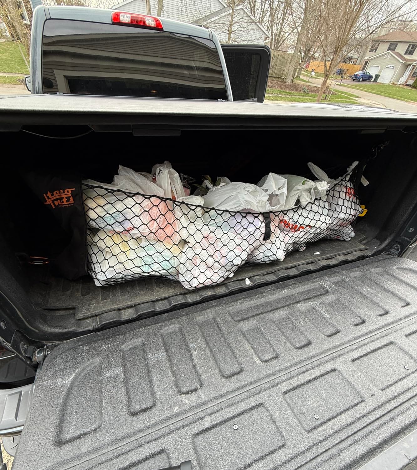TacoNets Envelope Cargo Net for GMC Sierra & Chevy Silverado - Fits 2013-Current - Upgraded 5mm Bungee - Integrated Storage Bag - Heavy Duty Carabiners customer photo 2
