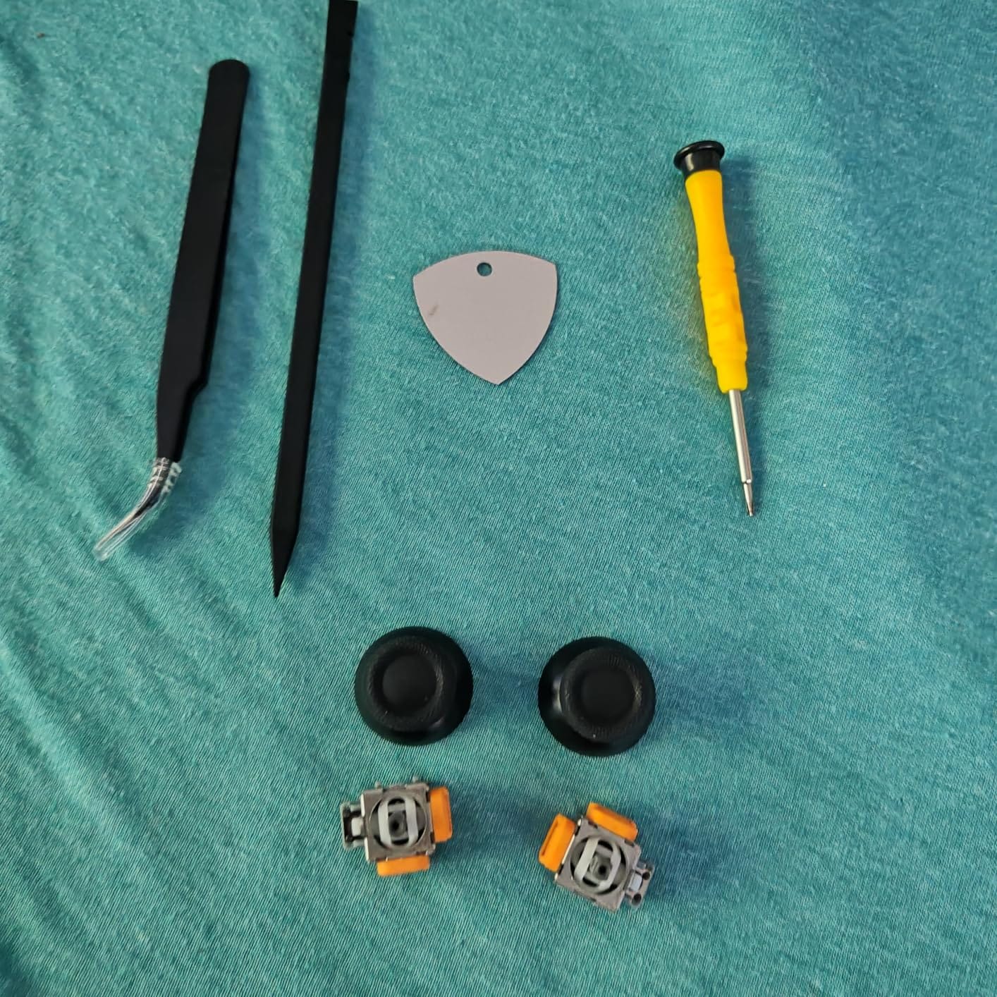 Hall Effect Joystick Repair Kit Compatible with PS5 Controller, SourceTon Anti Drift Replacement Kit with 2 Hall Joysticks, 2 Thumbstick Caps, Metal Tweezer, Screwdriver, Pry Tools customer photo 1